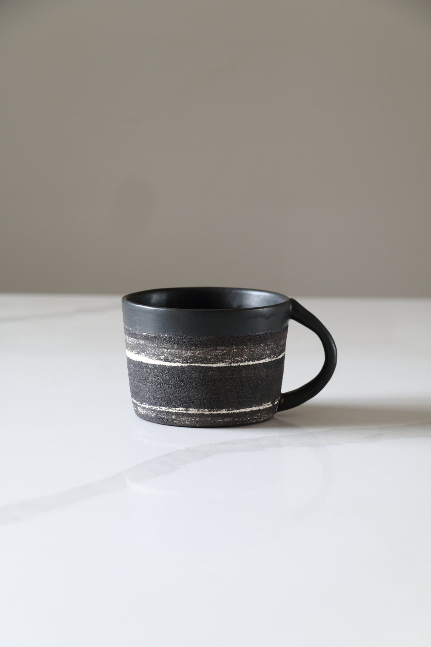 Meta-Morphic Coffee Cup • 10oz • Black