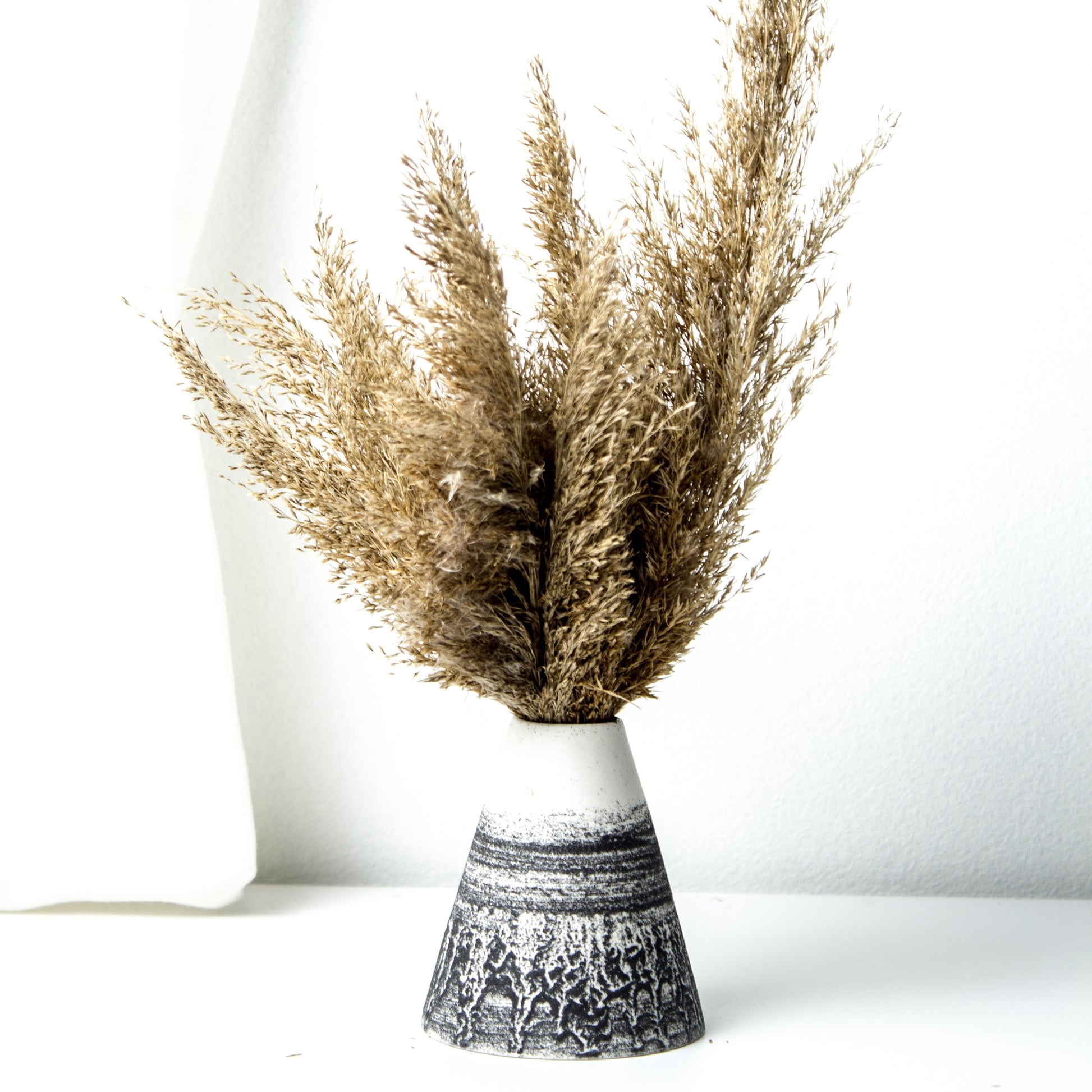 -Cone Shape Vases in 3 sizes l Home / Office / Cafe Deco -Clear glaze on white porcelain clay -Modern simple shape + natural texture *Basalt Collection Drawing of mixture of dark minerals. The unique organic drawing is applied in a rotation motion of my wheel.
